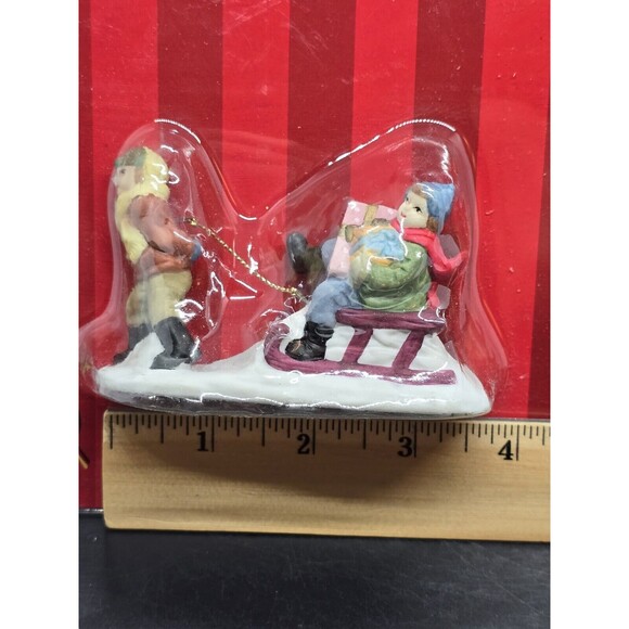 Vtg Caldor Share the Joy Village Accessorie Lady Pulling Boy On Sled With Gifts - Picture 3 of 5